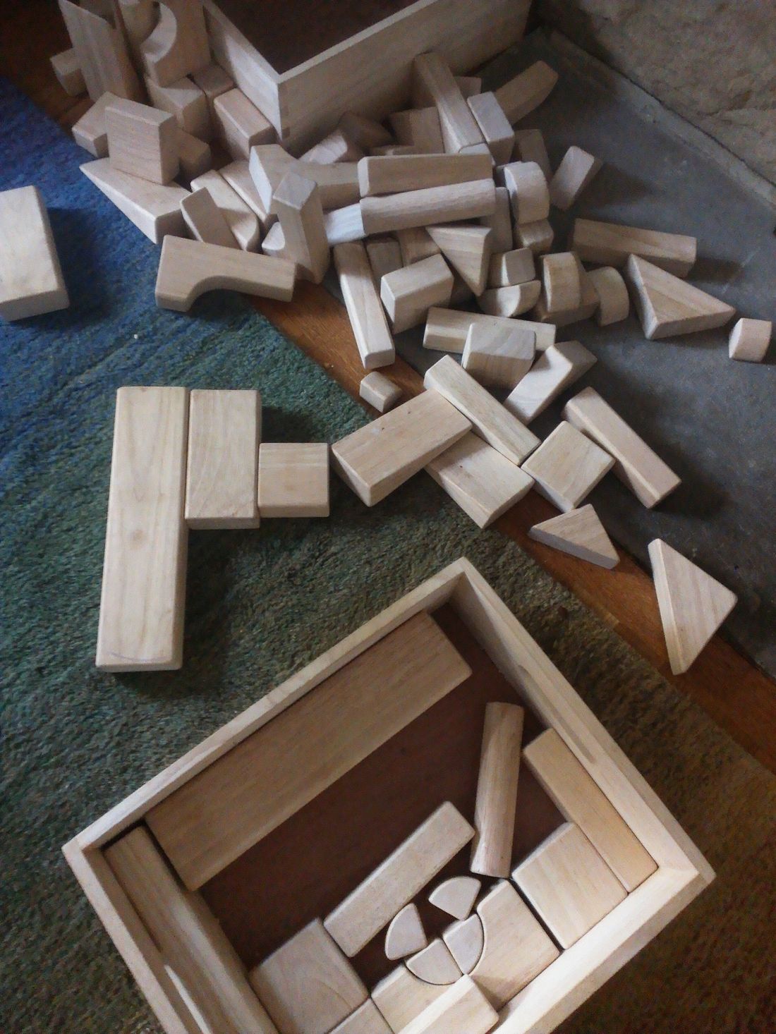 Two sets of wooden toy building blocks