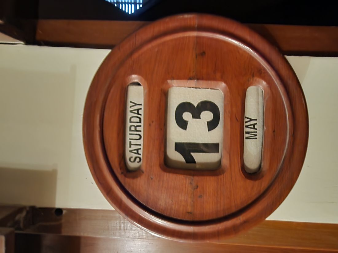 A manual wooden wall calendar